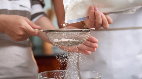 two-unrecognizable-women-pouring-flour-into-sieve-kitchen-home.jpg